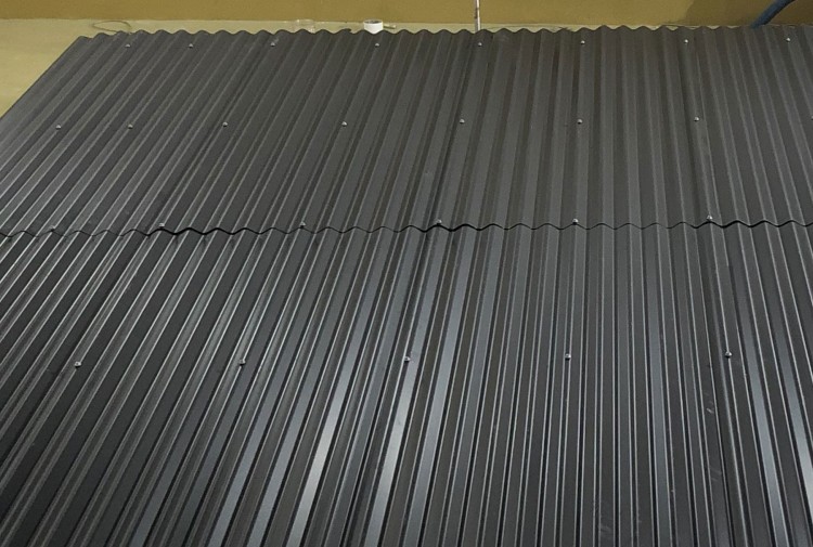 Metal roof treated with Decidamp SP80 for rainfall noise reduction